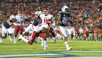 JaTarvious Whitlow scores the first of his two touchdowns against Arkansas on Saturday. (Photo by Michael Chang/Getty Images)