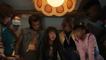 STRANGER THINGS. (L to R) Natalia Dyer as Nancy Wheeler, Gaten Matarazzo as Dustin Henderson, Joe Keery as Steve Harrington, Joseph Quinn as Eddie Munson, Maya Hawke as Robin Buckley, Priah Ferguson as Erica Sinclair, Sadie Sink as Max Mayfield, and Caleb McLaughlin as Lucas Sinclair in STRANGER THINGS. Cr. Courtesy of Netflix © 2022
