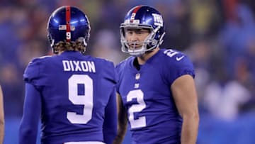 EAST RUTHERFORD, NEW JERSEY - DECEMBER 02: Aldrick Rosas #2 of the New York Giants is congratulated by teammate Riley Dixon #9 after Rosas kicked the game winning field goal in overtime against the Chicago Bears at MetLife Stadium on December 02, 2018 in East Rutherford, New Jersey. (Photo by Elsa/Getty Images)