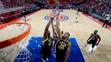 DETROIT, MI - OCTOBER 9: Ben Moore #26 of the Indiana Pacers jumps for the rebound on October 9, 2017 at Little Caesars Arena in Detroit, Michigan. NOTE TO USER: User expressly acknowledges and agrees that, by downloading and/or using this photograph, User is consenting to the terms and conditions of the Getty Images License Agreement. Mandatory Copyright Notice: Copyright 2017 NBAE (Photo by Chris Schwegler/NBAE via Getty Images)