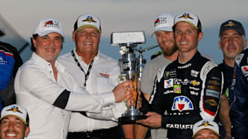INDIANAPOLIS, IN - JULY 23: Kasey Kahne, driver of the #5 Farmers Insurance Chevrolet, celebrates with the trophy after winning the Monster Energy NASCAR Cup Series Brickyard 400 at Indianapolis Motorspeedway on July 23, 2017 in Indianapolis, Indiana. (Photo by Brian Lawdermilk/Getty Images)