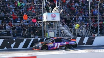 Mar 29, 2015; Martinsville, VA, USA; Sprint Cup Series driver Denny Hamlin (11) wins the STP 500 at Martinsville Speedway. Mandatory Credit: Randy Sartin-USA TODAY Sports