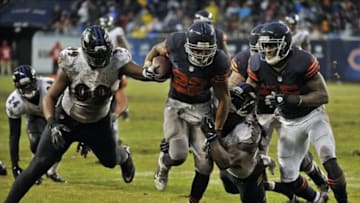 Nov 17, 2013; Chicago, IL, USA; Chicago Bears running back Matt Forte (22) breaks a tackle against Baltimore Ravens strong safety James Ihedigbo (32) to score a touchdown during the second half at Soldier Field. Mandatory Credit: Rob Grabowski-USA TODAY Sports