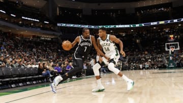 Oct 12, 2022; Milwaukee, Wisconsin, USA; Brooklyn Nets forward Kevin Durant (7) drives for the basket against Milwaukee Bucks forward Giannis Antetokounmpo (34) during the third quarter at Fiserv Forum. Mandatory Credit: Jeff Hanisch-USA TODAY Sports