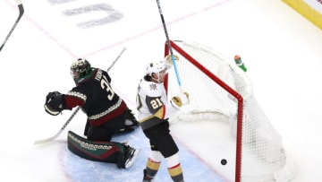 Darcy Kuemper #35 of the Arizona Coyotes is unable to stop a power play goal by Reilly Smith of the Vegas Golden Knights as Nick Cousins #21 of the Vegas Golden Knights celebrates. (Photo by Jeff Vinnick/Getty Images)