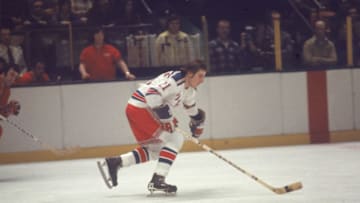 Canadian professional ice hockey player Pete Stemkowski #21 of the New York Rangers skates on the ice during a game at Madison Square Garden as opponent Guy Lapointe (left) of the Montreal Canadiens approaches at some distance, New York, 1970s. Stemkowski played for the Rangers from 1971 to 1977. (Photo by Melchior DiGiacomo/Getty Images)