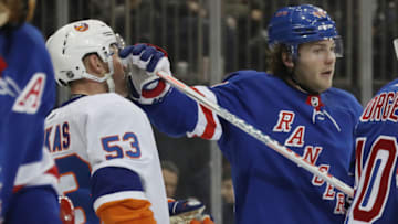 NEW YORK, NEW YORK - JANUARY 21: Brendan Lemieux #48 of the New York Rangers gets the stick up on Casey Cizikas #53 of the New York Islanders during a timeout during the third period at Madison Square Garden on January 21, 2020 in New York City. The Islanders defeated the Rangers 4-2. (Photo by Bruce Bennett/Getty Images)