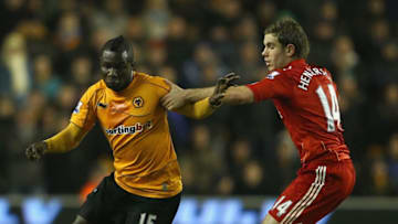 WOLVERHAMPTON, ENGLAND - JANUARY 31: Emmanuel Frimpong of Wolves is tackled by Jordan Henderson of Liverpool during the Barclays Premier League match between Wolverhampton Wanderers and Liverpool at Molineux on January 31, 2012 in Wolverhampton, England. (Photo by Clive Mason/Getty Images)