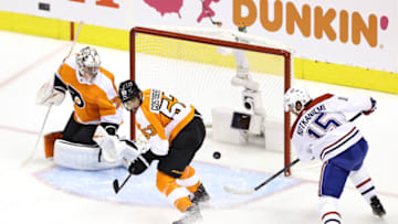 TORONTO, ONTARIO - AUGUST 14: Jesperi Kotkaniemi #15 of the Montreal Canadiens takes a shot on Carter Hart #79 of the Philadelphia Flyers during the first period in Game Two of the Eastern Conference First Round during the 2020 NHL Stanley Cup Playoffs at Scotiabank Arena on August 14, 2020 in Toronto, Ontario, Canada. (Photo by Elsa/Getty Images)