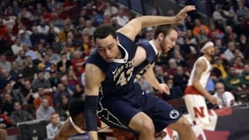 Mar 11, 2015; Chicago, IL, USA; Penn State Nittany Lions forward Ross Travis (43) fouls Nebraska Cornhuskers guard Tarin Smith (11) during the first half in the first round of the Big Ten Conference Tournament at the United Center. Mandatory Credit: David Banks-USA TODAY Sports