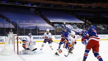 The New York Islanders defend against the New York Rangers. (Photo by Bruce Bennett/Getty Images)