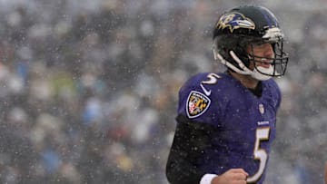 BALTIMORE, MD - DECEMBER 08: Quarterback Joe Flacco #5 of the Baltimore Ravens celebrates after throwing a touchdown against the Minnesota Vikings in the first quarter at M&T Bank Stadium on December 8, 2013 in Baltimore, Maryland. (Photo by Patrick Smith/Getty Images)