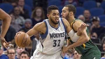 Nov 28, 2016; Minneapolis, MN, USA; Minnesota Timberwolves center Karl-Anthony Towns (32) backs towards the basket as Utah Jazz center Rudy Gobert (27) plays defense in the second half at Target Center. The Jazz won 112-103. Mandatory Credit: Jesse Johnson-USA TODAY Sports