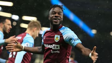 Burnley's Ivorian defender Maxwel Cornet celebrates after scoring there third goal during the English Premier League football match between Burnley and Everton at Turf Moor in Burnley, north west England on April 6, 2022. - RESTRICTED TO EDITORIAL USE. No use with unauthorized audio, video, data, fixture lists, club/league logos or 'live' services. Online in-match use limited to 120 images. An additional 40 images may be used in extra time. No video emulation. Social media in-match use limited to 120 images. An additional 40 images may be used in extra time. No use in betting publications, games or single club/league/player publications. (Photo by Lindsey Parnaby / AFP) / RESTRICTED TO EDITORIAL USE. No use with unauthorized audio, video, data, fixture lists, club/league logos or 'live' services. Online in-match use limited to 120 images. An additional 40 images may be used in extra time. No video emulation. Social media in-match use limited to 120 images. An additional 40 images may be used in extra time. No use in betting publications, games or single club/league/player publications. / RESTRICTED TO EDITORIAL USE. No use with unauthorized audio, video, data, fixture lists, club/league logos or 'live' services. Online in-match use limited to 120 images. An additional 40 images may be used in extra time. No video emulation. Social media in-match use limited to 120 images. An additional 40 images may be used in extra time. No use in betting publications, games or single club/league/player publications. (Photo by LINDSEY PARNABY/AFP via Getty Images)