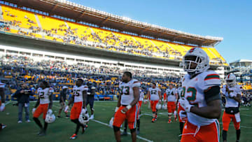 PITTSBURGH, PA - NOVEMBER 24: The Miami Hurricanes walk off the field after being upset 24-14 against the Pittsburgh Panthers on November 24, 2017 at Heinz Field in Pittsburgh, Pennsylvania. (Photo by Justin K. Aller/Getty Images)