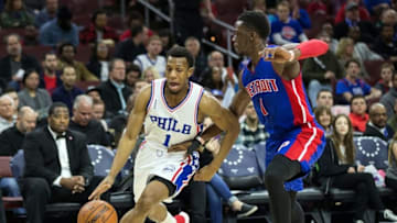 Mar 12, 2016; Philadelphia, PA, USA; Philadelphia 76ers guard Ish Smith (1) dribbles past Detroit Pistons guard Reggie Jackson (1) during the first quarter at Wells Fargo Center. Mandatory Credit: Bill Streicher-USA TODAY Sports