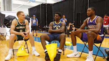 TARRYTOWN, NY - AUGUST 12: Aaron Holiday #3 of the Indiana Pacers, Mikal Bridges #25 of the Phoenix Suns and Donte DiVincenzo #9 of the Milwaukee Bucks talk during the 2018 NBA Rookie Shoot on August 12, 2018 at the Madison Square Garden Training Center in Tarrytown, New York. NOTE TO USER: User expressly acknowledges and agrees that, by downloading and/or using this Photograph, user is consenting to the terms and conditions of the Getty Images License Agreement. Mandatory Copyright Notice: Copyright 2018 NBAE (Photo by Michelle Farsi/NBAE via Getty Images)