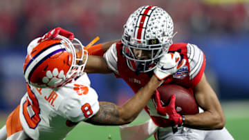 GLENDALE, ARIZONA - DECEMBER 28: Chris Olave #17 of the Ohio State Buckeyes runs the ball against A.J. Terrell #8 of the Clemson Tigers in the first half during the College Football Playoff Semifinal at the PlayStation Fiesta Bowl at State Farm Stadium on December 28, 2019 in Glendale, Arizona. (Photo by Matthew Stockman/Getty Images)