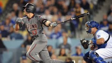 April 14, 2016; Los Angeles, CA, USA; Arizona Diamondbacks shortstop Nick Ahmed (13) hits an RBI single in the fifth inning against Los Angeles Dodgers at Dodger Stadium. Mandatory Credit: Gary A. Vasquez-USA TODAY Sports