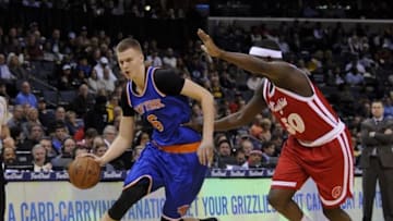 Jan 16, 2016; Memphis, TN, USA; New York Knicks forward Kristaps Porzingis (6) goes to the basket against Memphis Grizzlies forward Zach Randolph (50) during the first quarter at FedExForum. Mandatory Credit: Justin Ford-USA TODAY Sports
