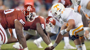 NORMAN, OK - SEPTEMBER 13: Defensive tackle Jordan Phillips #80 of the Oklahoma Sooners stares up at center Mack Crowder #57 of the Tennessee Volunters during first half action of their game on September 13, 2014 at Gaylord Family Memorial Stadium Norman, Oklahoma. (Photo by Jackson Laizure/Getty Images)