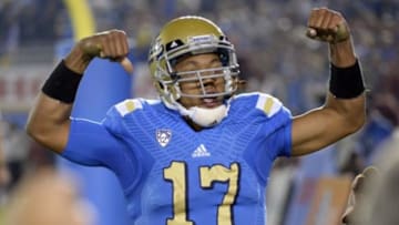 Nov 22, 2014; Pasadena, CA, USA; UCLA Bruins quarterback Brett Hundley (17) celebrates after scoring a touchdown against the Southern California Trojans during the second half at the Rose Bowl. Mandatory Credit: Richard Mackson-USA TODAY Sports