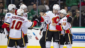 Dec 6, 2016; Dallas, TX, USA; Calgary Flames right wing Kris Versteeg (10) and defenseman TJ Brodie (7) and right wing Troy Brouwer (36) and center Sean Monahan (23) and left wing Johnny Gaudreau (13) celebrate Monahan