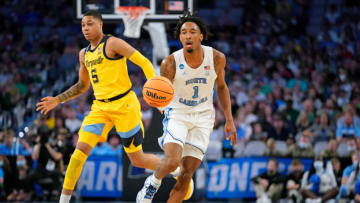 Mar 17, 2022; Fort Worth, TX, USA; North Carolina Tar Heels guard Leaky Black (1) dribbles the ball against Marquette Golden Eagles guard Greg Elliott (5) during the first half during the first round of the 2022 NCAA Tournament at Dickies Arena. Mandatory Credit: Chris Jones-USA TODAY Sports