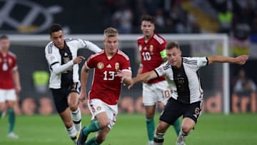 Bayern Munich midfielders Joshua Kimmich and Jamal Musiala in action for Germany against Hungary. (Photo by RONNY HARTMANN/AFP via Getty Images)