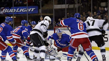 Feb 12, 2016; New York, NY, USA; New York Rangers goalie Antti Raanta (32) keeps his eye on the puck controlled by Los Angeles Kings left wing Milan Lucic (17) during the third period at Madison Square Garden. The Kings defeated the Rangers 5-4 in overtime. Mandatory Credit: Adam Hunger-USA TODAY Sports