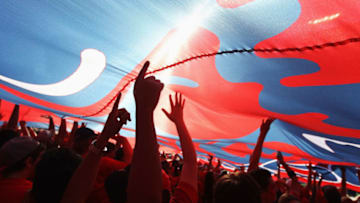 TUCSON, AZ - NOVEMBER 28: Arizona Wildcats fans hold up a large flag in celebration during the Territorial Cup college football game against the Arizona State Sun Devils at Arizona Stadium on November 28, 2014 in Tucson, Arizona. The Wildcats defeated the Sun Devils 42-35 to win the PAC-12 south championship. (Photo by Christian Petersen/Getty Images)