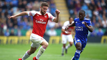 LEICESTER, ENGLAND - APRIL 28: Shkodran Mustafi of Arsenal is chased by Nampalys Mendy of Leicester City during the Premier League match between Leicester City and Arsenal FC at The King Power Stadium on April 28, 2019 in Leicester, United Kingdom. (Photo by Julian Finney/Getty Images)
