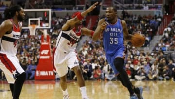Jan 21, 2015; Washington, DC, USA; Oklahoma City Thunder forward Kevin Durant (35) dribbles the ball as Washington Wizards forward Paul Pierce (34) defends in the fourth quarter at Verizon Center. The Thunder won 105-103 in overtime. Mandatory Credit: Geoff Burke-USA TODAY Sports