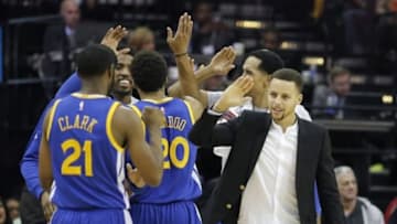 Dec 31, 2015; Houston, TX, USA; Golden State Warriors forward James Michael McAdoo (20) high fives his teammates during a Houston Rockets timeout in the second half at Toyota Center. The Warriors won 114 to 110. Mandatory Credit: Thomas B. Shea-USA TODAY Sports