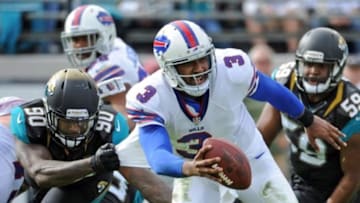 Dec 15, 2013; Jacksonville, FL, USA; Buffalo Bills quarterback EJ Manuel (3) tries to get away from Jacksonville Jaguars defensive end Andre Branch (90) during the first half at EverBank Field. Mandatory Credit: Melina Vastola-USA TODAY Sports