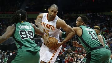 Apr 9, 2016; Atlanta, GA, USA; Atlanta Hawks center Al Horford (15) drives against Boston Celtics forward Jae Crowder (99) and guard Evan Turner (11) in the second quarter of their game at Philips Arena. The Hawks won 118-107. Mandatory Credit: Jason Getz-USA TODAY Sports