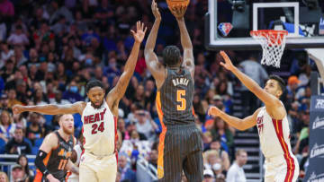 Orlando Magic center Mo Bamba (5) shoots the ball against Miami Heat forward Haywood Highsmith (24) and center Omer Yurtseven (77)( Mike Watters-USA TODAY Sports)