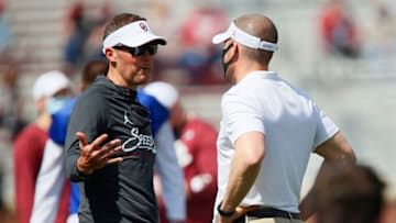 NORMAN, OK - APRIL 24: Head coach Lincoln Riley of the Oklahoma Sooners talks with defensive coordinator Alex Grinch before their spring game at Gaylord Family Oklahoma Memorial Stadium on April 24, 2021 in Norman, Oklahoma. (Photo by Brian Bahr/Getty Images)