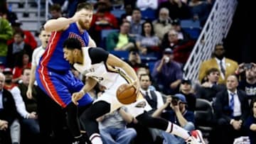 Jan 21, 2016; New Orleans, LA, USA; New Orleans Pelicans forward Anthony Davis (23) drives past Detroit Pistons center Aron Baynes (12) during the second quarter of a game at the Smoothie King Center. Mandatory Credit: Derick E. Hingle-USA TODAY Sports