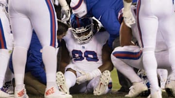 Dec 22, 2016; Philadelphia, PA, USA; New York Giants defensive tackle Damon Harrison (98) is tended to by trainers after being injured against the Philadelphia Eagles during the third quarter at Lincoln Financial Field. The Philadelphia Eagles won 24-19. Mandatory Credit: Bill Streicher-USA TODAY Sports