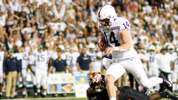 COLLEGE PARK, MD - SEPTEMBER 27: Penn State Nittany Lions quarterback Sean Clifford (14) scores on an 8 yard run in the first quarter against Maryland Terrapins defensive back Jordan Mosley (18) on September 27, 2019, at Capital One Field at Maryland Stadium in College Park, MD. Photo by Mark Goldman/Icon Sportswire via Getty Images)