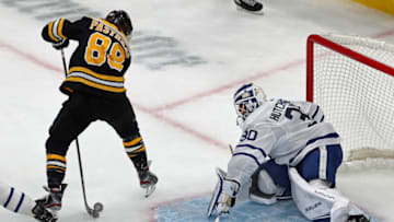 BOSTON - OCTOBER 22: Boston Bruins' David Pastrnak (88) scores the first goal of the game in the first period as he puts the puck between his own legs and then through the legs of Toronto goalie Michael Hutchinson (30). The Boston Bruins host the Toronto Maple Leafs in a regular season NHL hockey game at TD Garden in Boston on Oct. 22, 2019. (Photo by Jim Davis/The Boston Globe via Getty Images)