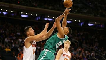 Oct 15, 2016; New York, NY, USA; Boston Celtics forward jordan Mickey (55) shoots the ball in front of New York Knicks center Willy Hernangomez (14) during the second half at Madison Square Garden. The Celtics won 119-107. Mandatory Credit: Andy Marlin-USA TODAY Sports