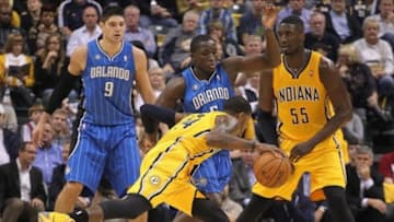 Oct 29, 2013; Indianapolis, IN, USA; Indiana Pacers forward Paul George (24) drives to the basket against Orlando Magic guard Victor Oladipo (5) at Bankers Life Fieldhouse. Mandatory Credit: Brian Spurlock-USA TODAY Sports
