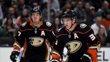 ANAHEIM, CALIFORNIA - SEPTEMBER 24: Jakob Silfverberg #33 of the Anaheim Ducks skates back with Rickard Rakell #67 during the second period in a preseason game against the San Jose Sharks at Honda Center on September 24, 2019 in Anaheim, California. (Photo by Harry How/Getty Images)