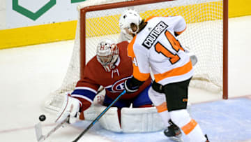 Aug 21, 2020; Toronto, Ontario, CAN; Montreal Canadiens goaltender Carey Price (31) makes a save against Philadelphia Flyers center Sean Couturier (14) during the second period in game six of the first round of the 2020 Stanley Cup Playoffs at Scotiabank Arena. Mandatory Credit: Dan Hamilton-USA TODAY Sports