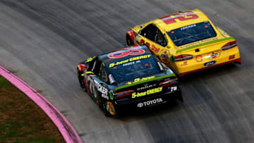 MARTINSVILLE, VA - OCTOBER 28: Joey Logano, driver of the #22 Shell Pennzoil Ford, and Martin Truex Jr., driver of the #78 5-hour ENERGY/Bass Pro Shops Toyota, race during the Monster Energy NASCAR Cup Series First Data 500 at Martinsville Speedway on October 28, 2018 in Martinsville, Virginia. (Photo by Sean Gardner/Getty Images)