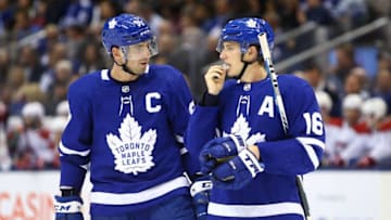 John Tavares #91 of the Toronto Maple Leafs talks to Mitchell Marner #16 during an NHL game against the Montreal Canadiens at Scotiabank Arena. (Photo by Vaughn Ridley/Getty Images)