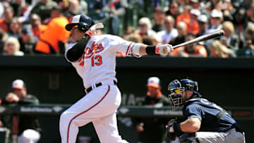 Apr 10, 2016; Baltimore, MD, USA; Baltimore Orioles third baseman Manny Machado (13) singles in the first inning against the Tampa Bay Rays at Oriole Park at Camden Yards. The Baltimore Orioles won 5-3. Mandatory Credit: Evan Habeeb-USA TODAY Sports