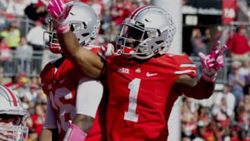 Oct 10, 2015; Columbus, OH, USA; Ohio State Buckeyes wide receiver Braxton Miller (1) and quarterback J.T. Barrett (16) celebrate after Barrett
